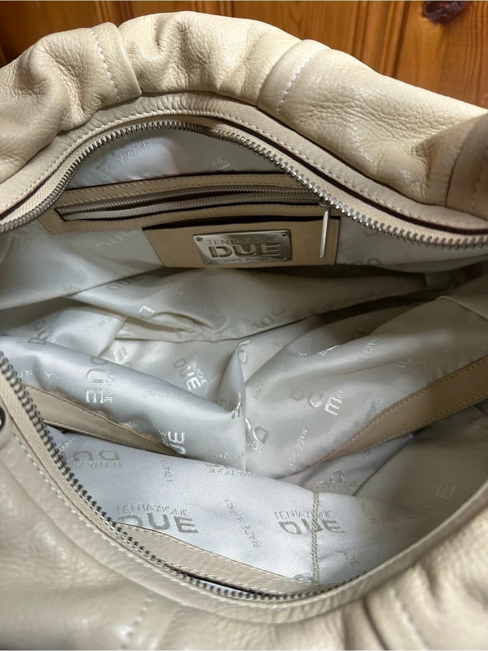 Cream Leather Shoulder Hobo Bag with Embossed Crest